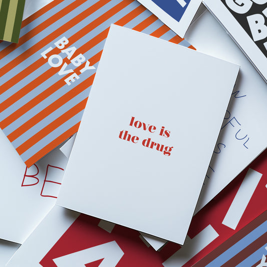 Love Is The Drug Greetings Card