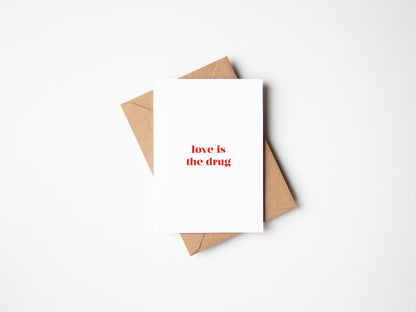 Love Is The Drug Greetings Card