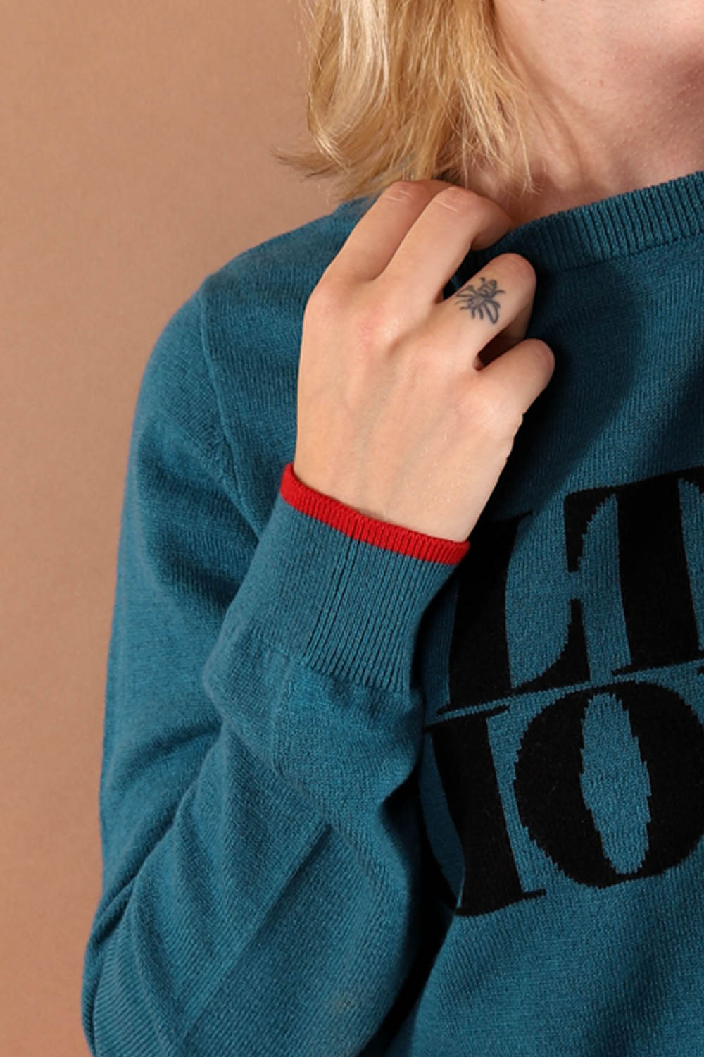 100% merino wool fine knit slogan jumper. Intarsia Ultra Violet slogan inspired by Andy Warhols superstars. Our retro colours pop and the super soft luxury knitwear supports slow sustainable fashion and independent brands.