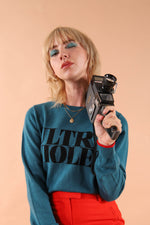 100% merino wool fine knit slogan jumper. Intarsia Ultra Violet slogan inspired by Andy Warhols superstars. Our retro colours pop and the super soft luxury knitwear supports slow sustainable fashion and independent brands.