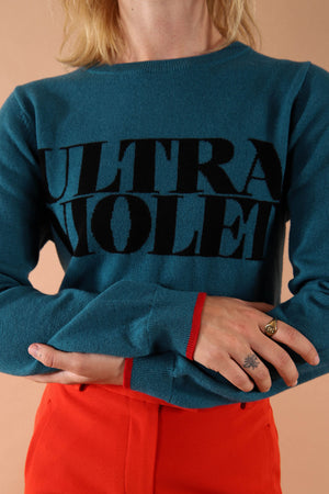 100% merino wool fine knit slogan jumper. Intarsia Ultra Violet slogan inspired by Andy Warhols superstars. Our retro colours pop and the super soft luxury knitwear supports slow sustainable fashion and independent brands.