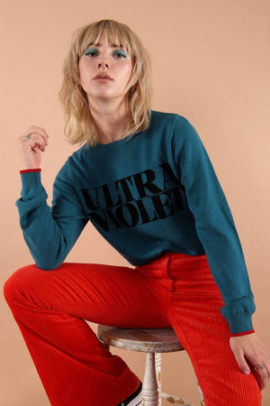 100% merino wool fine knit slogan jumper. Intarsia Ultra Violet slogan inspired by Andy Warhols superstars. Our retro colours pop and the super soft luxury knitwear supports slow sustainable fashion and independent brands.