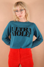 100% merino wool fine knit slogan jumper. Intarsia Ultra Violet slogan inspired by Andy Warhols superstars. Our retro colours pop and the super soft luxury knitwear supports slow sustainable fashion and independent brands.