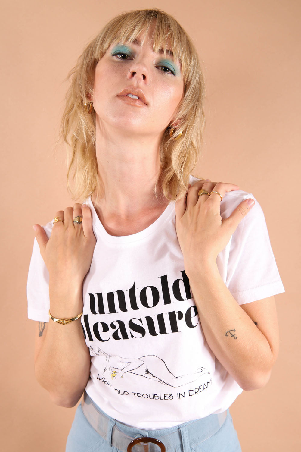 1960s muse Nico inspired illustrated graphic slogan t-shirt. Untold pleasures celebrates female empowerment and 60s style icons who made a statement. Made from organic cotton. Support Sustainable fashion